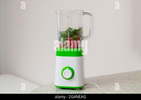 a simple abstract blender on the shelf table at home kitchen, making ...