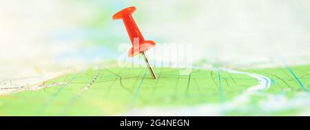 Location marking with red pin on map, travel and journey concept banner Stock Photo