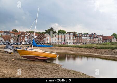 Boats out of the water at Blakeney during low tide on the North Norfolk coast in June 2021. Stock Photo