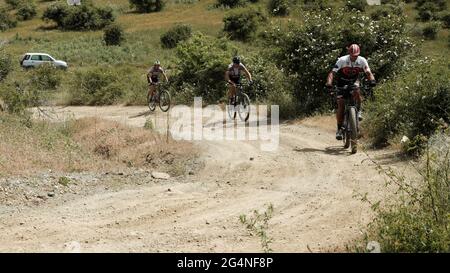 outdoor recreation in Sicily nature bikers riding along a mountain path of nebrodi Park Stock Photo