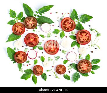 Cucumbers and tomatoes on a white background. Summer vegetarian pattern Stock Photo
