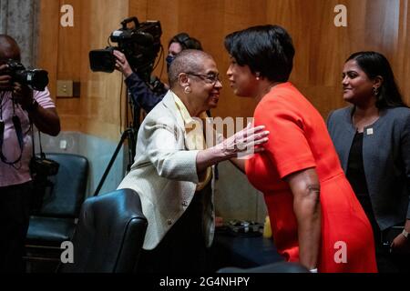Washington, United States Of America. 22nd June, 2021. DelegateEleanor Holmes Norton (Democrat of the District of Columbia), left, is greeted by Mayor Muriel Bowser (Democrat of the District of Columbia) as they arrive for a Senate Committee on Homeland Security and Governmental Affairs hearing to examine D.C. statehood, in the Dirksen Senate Office Building in Washington, DC, Tuesday, June 22, 2021. Credit: Rod Lamkey/CNP/Sipa USA Credit: Sipa USA/Alamy Live News Stock Photo