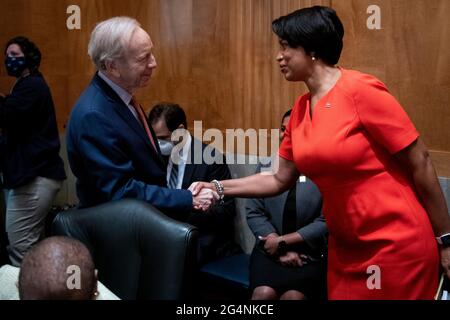 Washington, United States Of America. 22nd June, 2021. Former United States Senator Joseph I. Lieberman (Independent of Connecticut), left, is greeted by Mayor Muriel Bowser (Democrat of the District of Columbia) as they arrive for a Senate Committee on Homeland Security and Governmental Affairs hearing to examine D.C. statehood, in the Dirksen Senate Office Building in Washington, DC, Tuesday, June 22, 2021. Credit: Rod Lamkey/CNP/Sipa USA Credit: Sipa USA/Alamy Live News Stock Photo