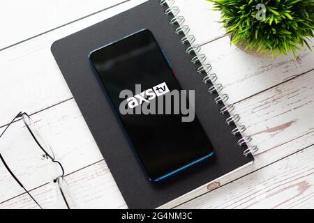 AXS TV logo on phone screen stock image. Stock Photo