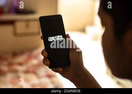 AXS TV logo on phone screen stock image. Stock Photo