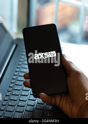 AXS TV logo on phone screen stock image. Stock Photo