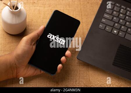 AXS TV logo on phone screen stock image. Stock Photo