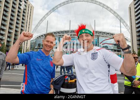 Wembley Stadium, Wembley Park, UK. 22nd June 2021.   England fans getting into the spirit outside Wembley Stadium, ahead of their teams game against the Czech Republic this evening.  The teams final Group D match of the UEFA European Football Championship at Wembley Stadium kicks off at 8pm.  Amanda Rose/Alamy Live News Stock Photo