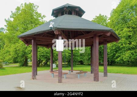 Terrace with benches in the city park. The modern landscape of the city park. City park infrastructure, park improvement Stock Photo