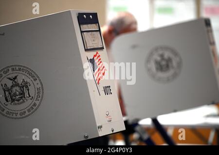 New York, USA. 22nd June, 2021. A voter takes part in the new “Ranked Choice Voting” at a polling station set up at The Metropolitan Museum of Art on New York's Primary Election Day, in New York, NY, June 22, 2021. Ranked Choice Voting is being implemented for the first time for Mayoral, Borough President, Comptroller and District representatives in New York City, allowing voters to choose multiple candidates in order of their preference; results are expected to take several weeks. (Photo by Anthony Behar/Sipa USA) Credit: Sipa USA/Alamy Live News Stock Photo