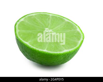 Half of lime isolated on white background. Fresh citrus in the cut. Green fruit full focus. Stock Photo