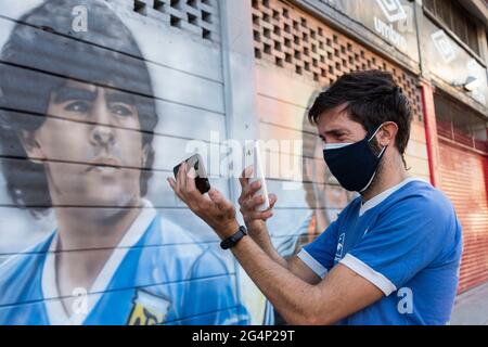 City of Buenos Aires, City of Buenos Aires, Argentina. 22nd June, 2021. INT. Sports. June 22, 2021, City of Buenos Aires, Argentina. Dozens of Diego MaradonaÂ´s supporters commemorate and celebrate the 'Goal of the Century'' -according to FIFA in 2002- made by Diego Armando Maradona 35 years ago at the World Cup FIFA Mexico 1986 on June 22 at 16:09 hours; at Diego Armando Maradona Stadium, City of Buenos Aires, Argentina. Credit: Julieta Ferrario/ZUMA Wire/Alamy Live News Stock Photo