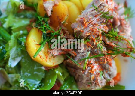 Pulled pork with salad and potatoes. Stock Photo