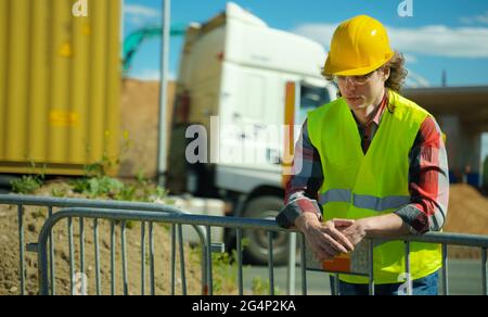 Male worker in hardhat and high vis jacket. Stock Photo