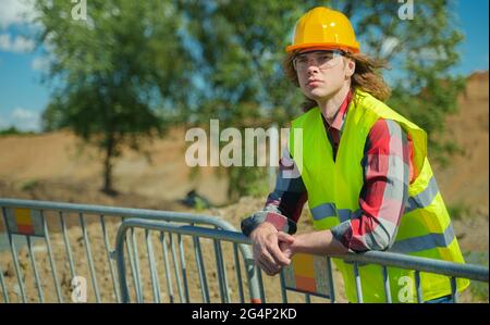 Male worker in hardhat and high vis jacket. Stock Photo