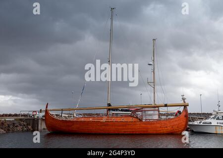 replica of a three-masted wooden Viking ship moored in the iceland sea Stock Photo