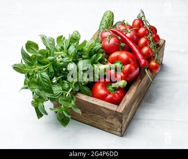fresh raw vegetables in wooden box Stock Photo