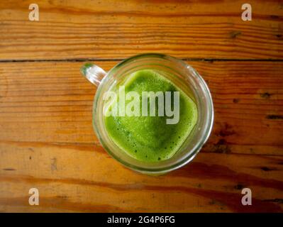 Lemonade Juice with Mint Served in a Pitcher in a Wooden Background Stock Photo