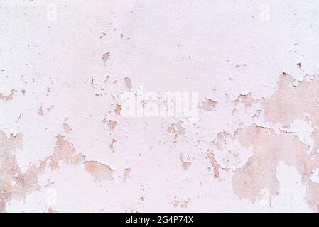 Old white shabby plaster wall. Background or texture. Stock Photo