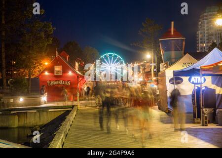 Bustling nightlife during summer at the Halifax harbor front waterfront on the Natal Day weekend at the Halifax Harbor, Nova Scotia, Canada Stock Photo