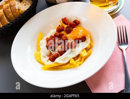 Fried eggs with chistorra Stock Photo