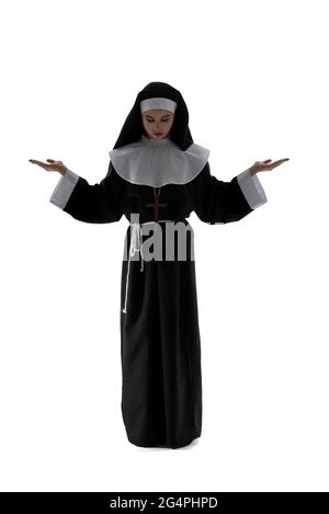 Young praying nun on white background Stock Photo