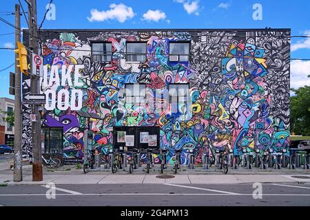 Toronto, Canada - Vegan restaurant in a trendy downtown neighborhood with an abstract mural by artist Jimmy Chiale on its outside wall, https://www.ji Stock Photo