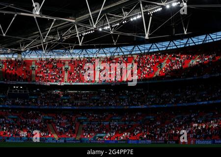 London, Britain. 22nd June, 2021. Spectators are seen prior to the Group D match between England and the Czech Republic at the UEFA EURO 2020 in London, Britain, on June 22, 2021. Credit: Han Yan/Xinhua/Alamy Live News Stock Photo