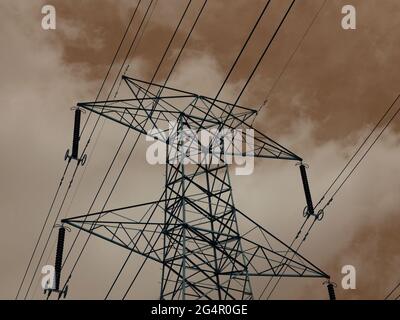 Electric power supply tower isolate on cloudy sky backdrop. Stock Photo
