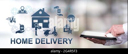 Man using a tablet with home delivery concept Stock Photo