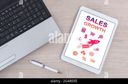 Sales growth concept shown on a digital tablet Stock Photo