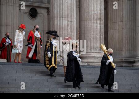 William Russell, the 692nd Lord Mayor of London (in guilded overcoat, centre) and official dignitaries descend the steps of St Paul's Cathedral after the private 'The Lord Mayor's Service of Reconciliation And Hope' function, on 22nd June 2021, in London, England. Stock Photo
