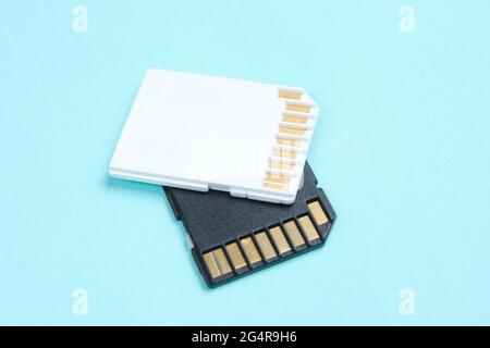 Two Mini SD memory cards on blue background close up Stock Photo