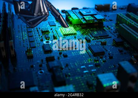 Circuit board chips and manipulator Stock Photo