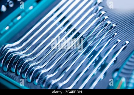 Set of new manual hand tools and wrenches for auto repair in green mechanic box. Stock Photo