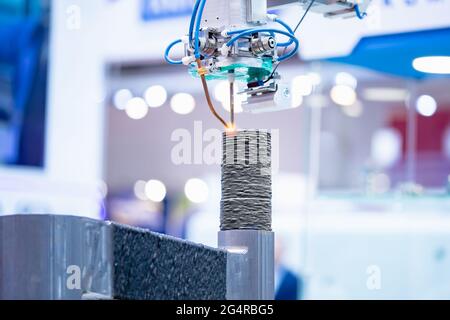 Closeup 3D Printer metal mechanism working element design of device during processes on factory. Stock Photo