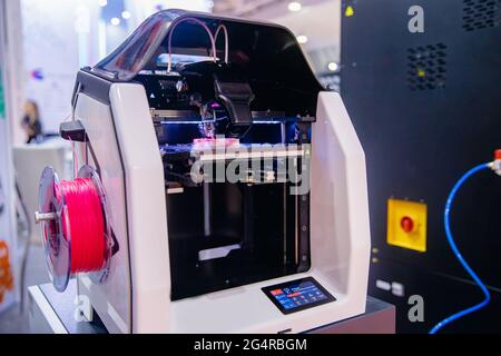 Auto Robot Modern 3D plastic printer printing figure. Stock Photo