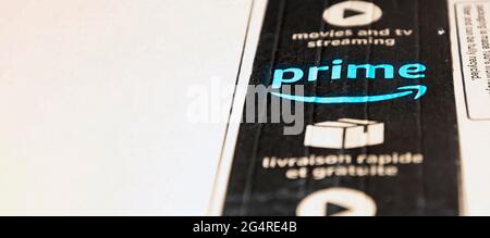 Rome, Italy, June 2021: The Amazon Prime logo printed on the black safety tape on a cardboard box. Packaging for shipping and online shopping. Illustr Stock Photo
