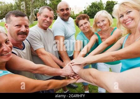 Happy people showing unity Stock Photo