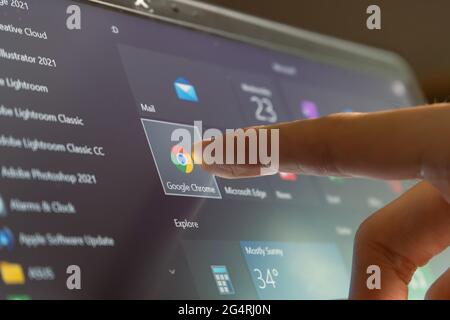 Bangkok, Thailand - June 23, 2021: Computer user touching on Google Chrome, a web browser developed by Google, icon on Windows 10 to open the program. Stock Photo