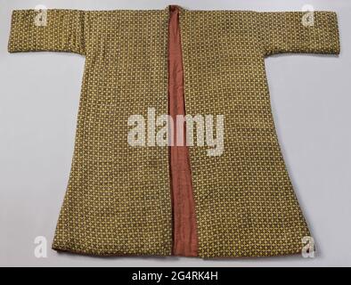 House jacket of printed silk, padded and lined with red silk. House jacket from yellow silk, on which with blocks in red and a dark color (indigo?) Is printed a geometric pattern of windows, flowers and dots. Ringing model, with a small upper board and partly reflected not too wide, long sleeves. Quilted with silk watts and lined with wine red side. Stock Photo
