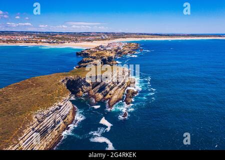 Aerial view of island Baleal naer Peniche on the shore of the ocean in west coast of Portugal. Baleal Portugal with incredible beach and surfers. Aeri Stock Photo