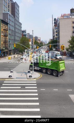 New York, USA - July 03, 2018: Truck on the 2nd Avenue and East Houston Street busy intersection. Stock Photo