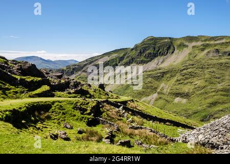 Slope down from Croesor slate quarry above Cwm Croesor with Cnicht mountain beyond in Moelwyn mountains of Snowdonia National Park. Gwynedd Wales UK Stock Photo