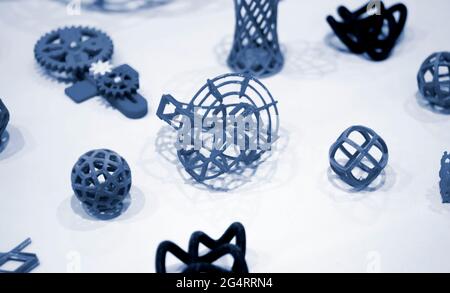 Many abstract models printed by 3d printer close-up. Stock Photo