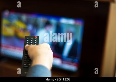 Someone who constantly changes channels while watching TV. selective focus remote control Stock Photo
