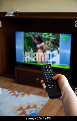 Someone who constantly changes channels while watching TV. selective focus remote control Stock Photo
