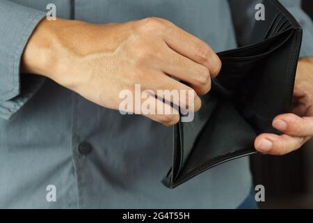 A Closeup hand man open an Empty Wallet. Stock Photo