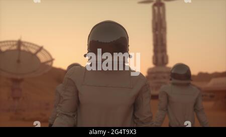 Three Astronauts in Space Suits Confidently Walking on Mars. Mars Colonization Concept. 3d rendering Stock Photo
