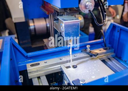 Electrolysis CNC milling machine for precise cutting of metal parts on factory. Stock Photo